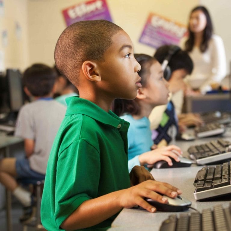 Student working on a computer in the classroom